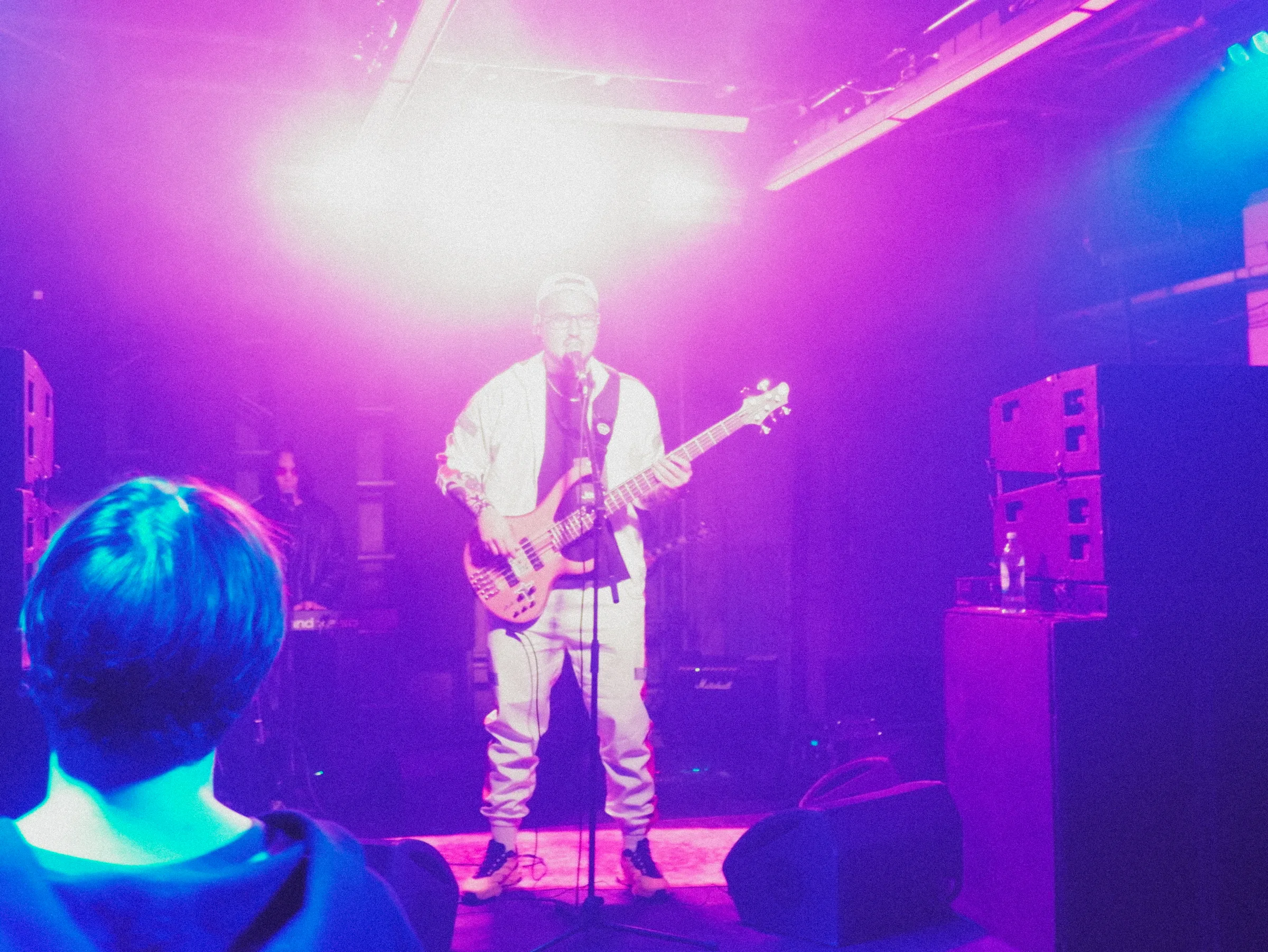 A singer in violet light