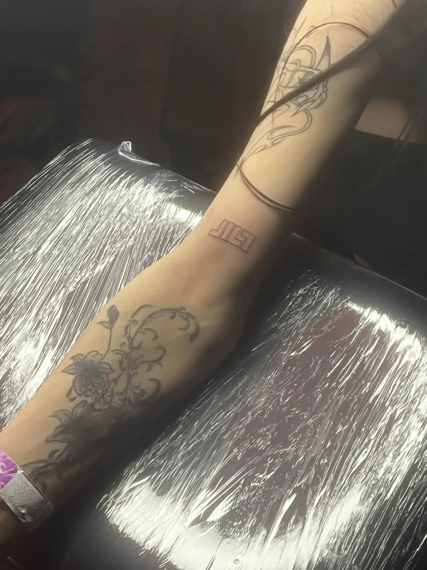 The JILT mark tattooed on a leg